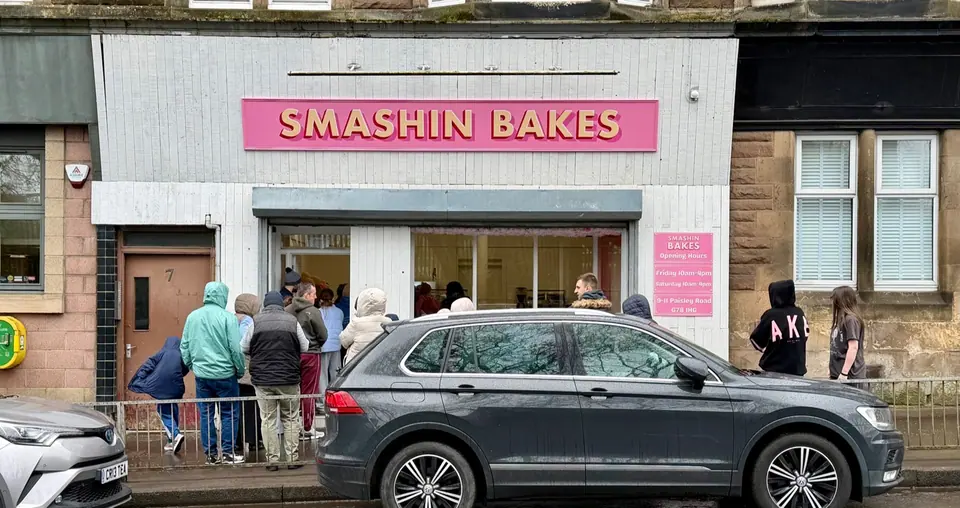 The Smashin' Bakes shopfront on Paisley Road, Barrhead, with customers queuing outside